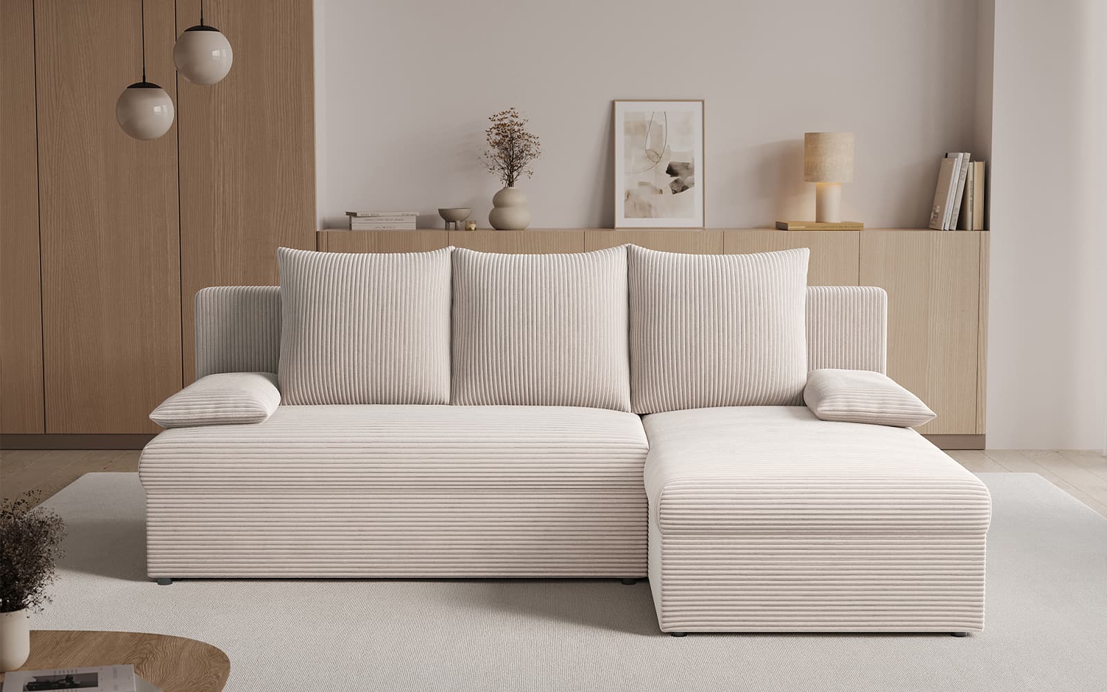 Neutral beige L-shaped sofa with matching cushions in a minimalist living room setting.