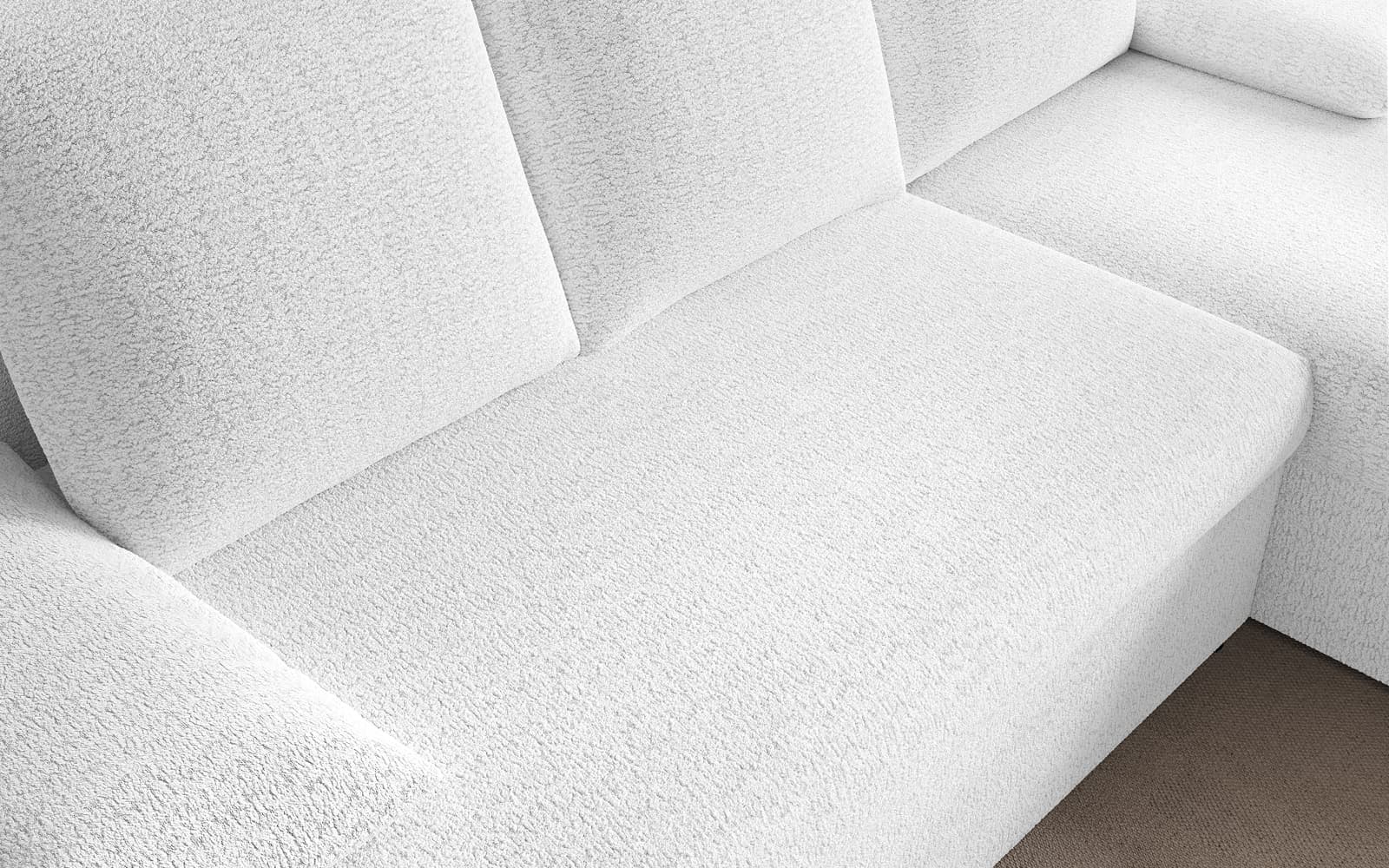 White textured sectional sofa with cushioned back and seat on a beige carpet, viewed from above.