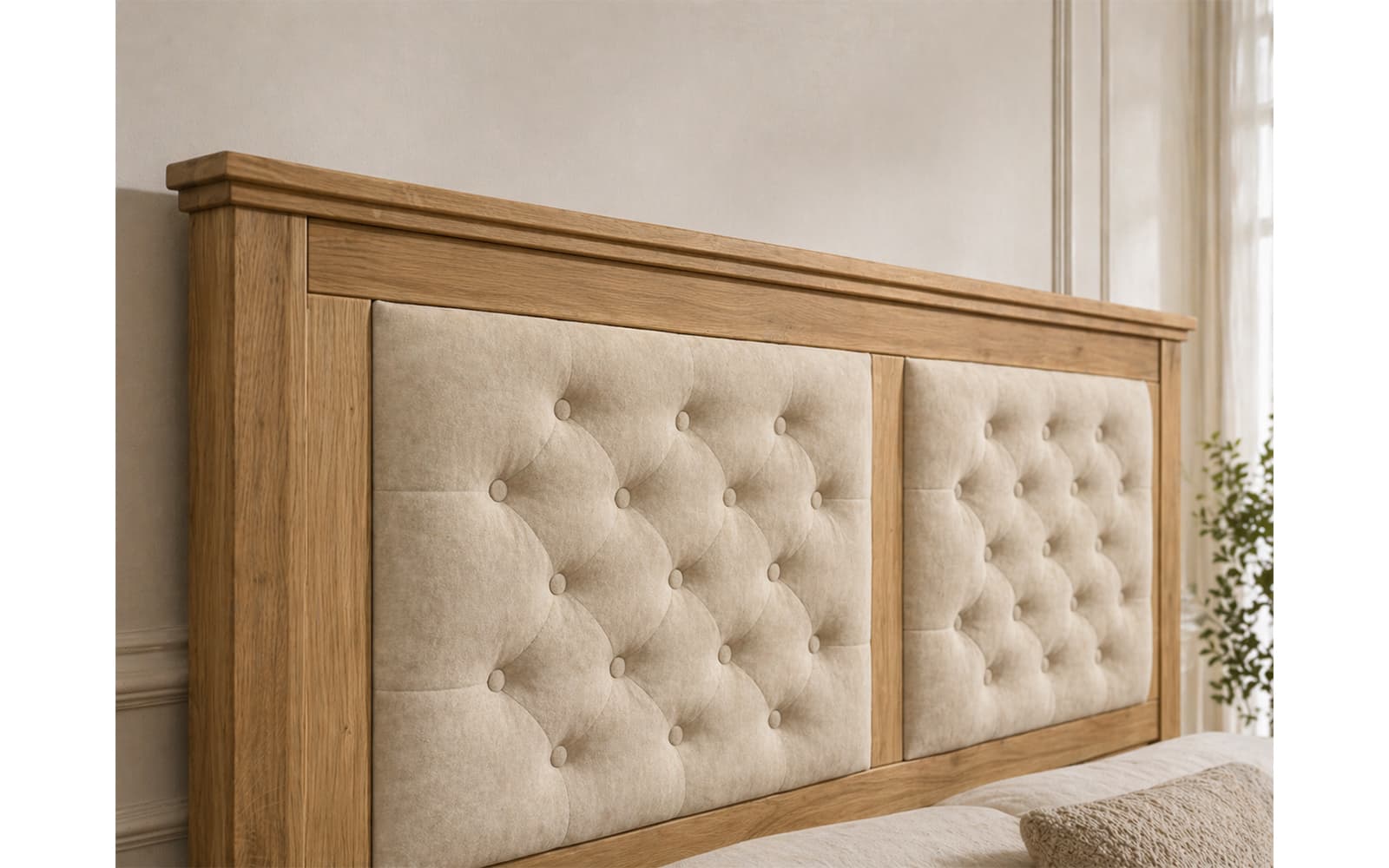 Wooden headboard with tufted beige upholstery and button-tufted panels in a neutral-toned bedroom setting.